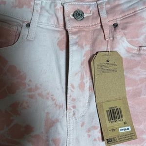 White and pink Levi skinny ankle jeans